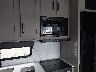 573TM2729S1****** Repairable 2025 Grand Design Recreational Momentum in Washington State